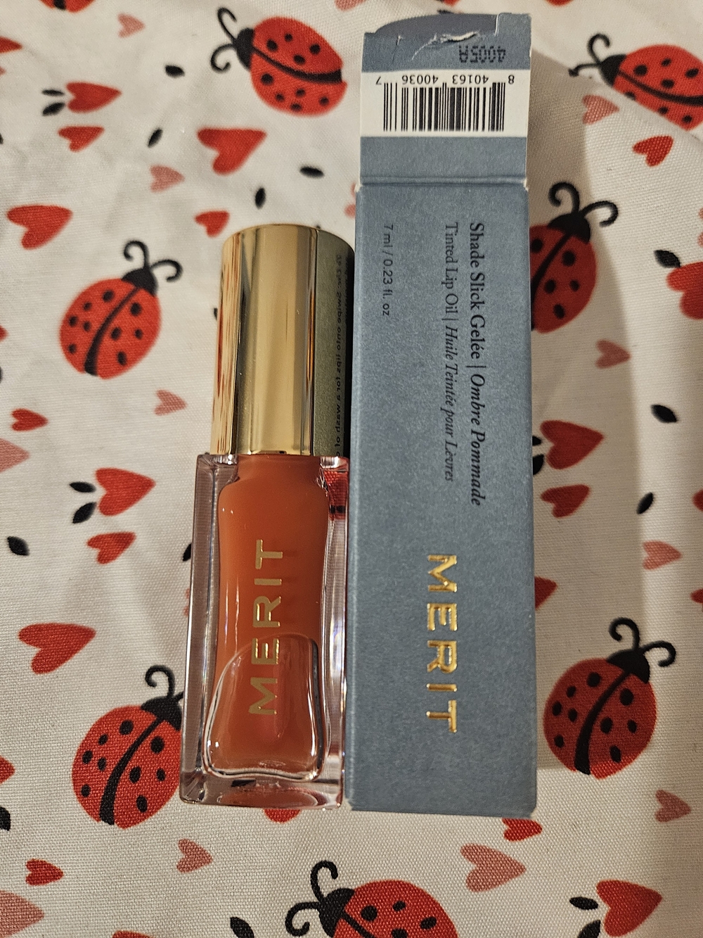 Merit Shade Slick Tinted Lip Oil — Warm Orange Jete